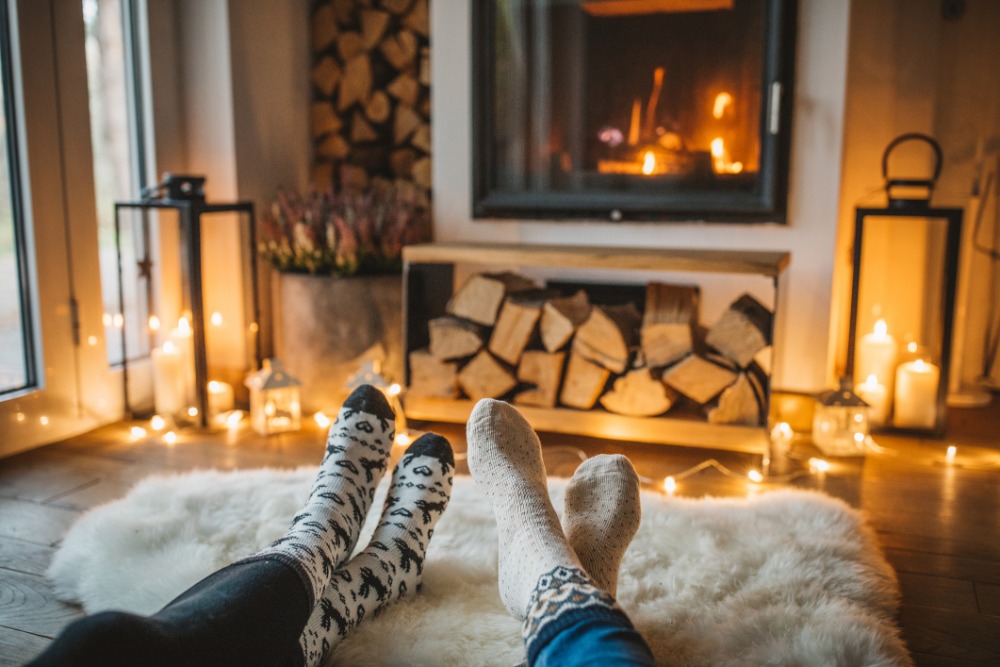 couple wearing sock on fireplace