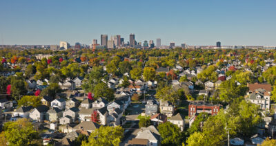 Aerial still image of the Downtown Columbus skyline taken by a drone flying over Reeb-Hosack, Ohio, on a clear, Fall day.